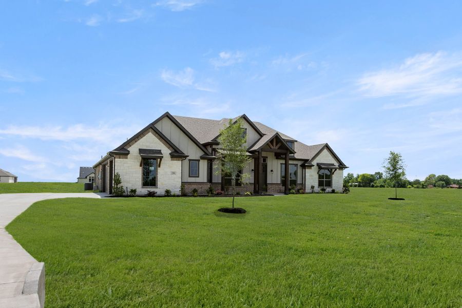 Front exterior of a new home in Pecan Acres, Red Oak, TX, highlighting curb appeal (Image 2). Front exterior of a new home in Pecan Acres, Red Oak, TX, highlighting curb appeal (Image 2).
