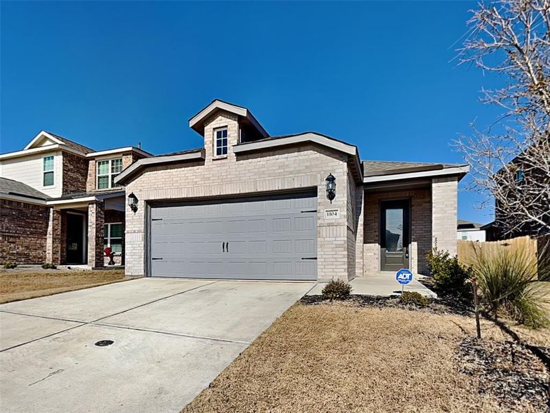 View of front of property featuring a garage