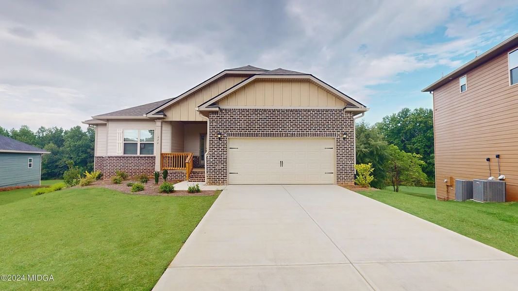 Front exterior of a new home in Oakview Estates, Macon, GA, highlighting curb appeal (Image 1).