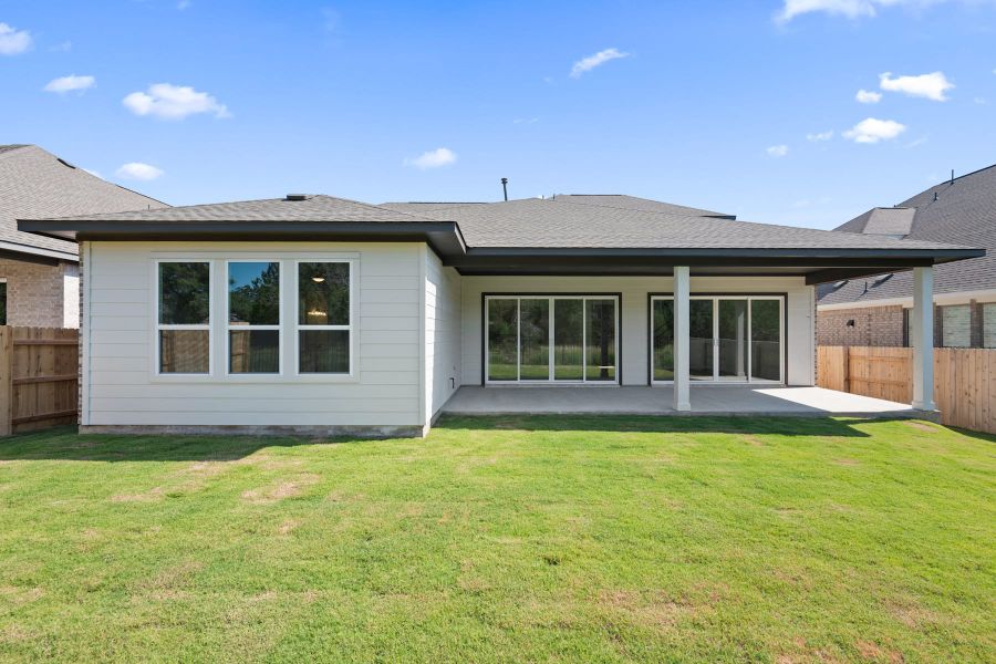 Exterior details and patio area of a home in Lariat, Liberty Hill (Image 27).