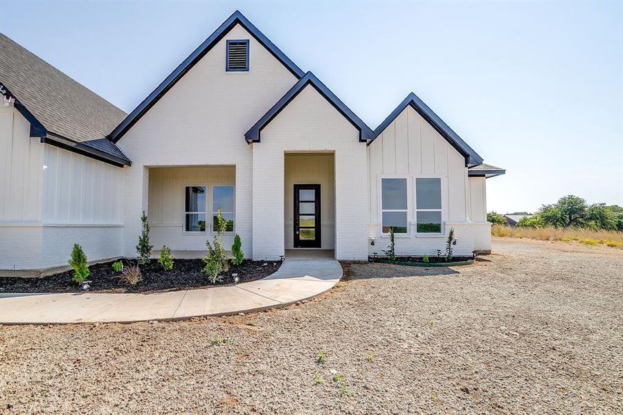 Front exterior of a new home in , Weatherford, TX, highlighting curb appeal (Image 20).