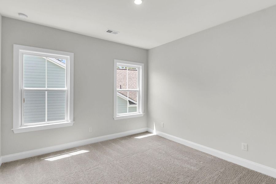 Spacious, unfurnished interior of a new home in Tidewater at Lakes of Cane Bay, Summerville (Image 17).