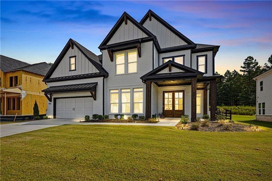 Front exterior of a new home in , Woodstock, GA, highlighting curb appeal (Image 2).