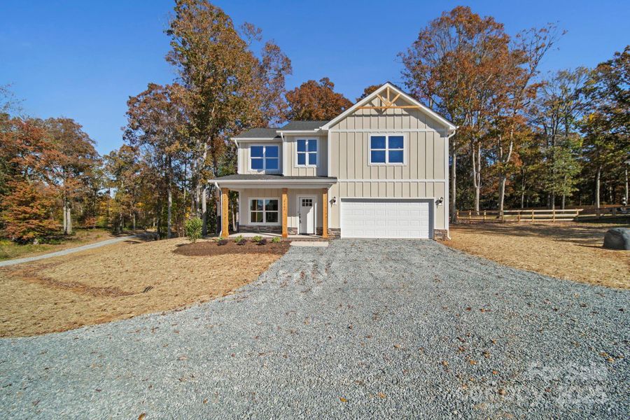Front exterior of a new home in , Monroe, NC, highlighting curb appeal (Image 2).