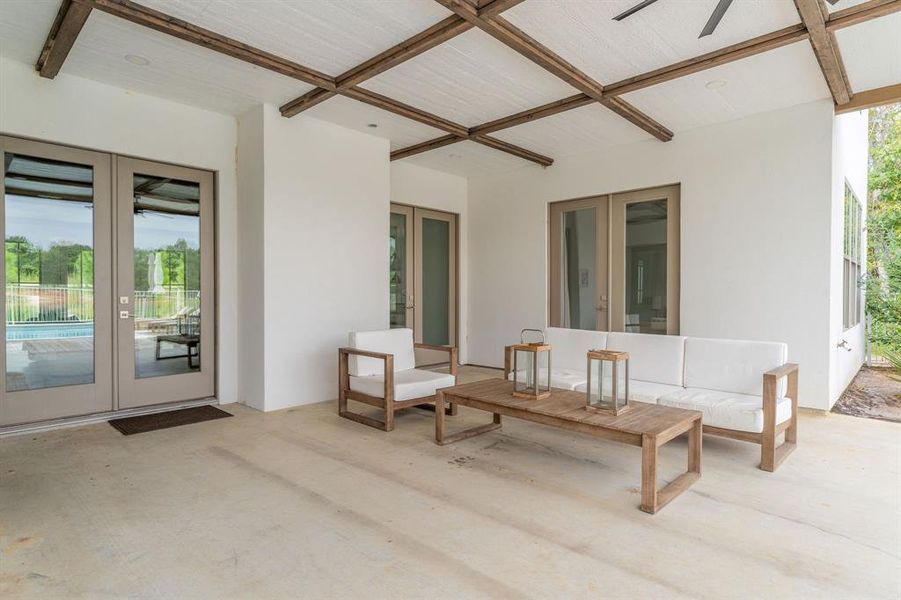 View of swimming pool with a patio area, outdoor dining area, and a ceiling fan View of swimming pool with a patio area, outdoor dining area, and a ceiling fan