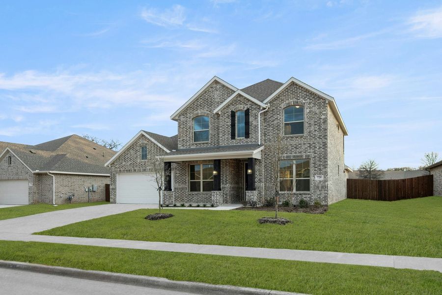 Front exterior of a new home in Stone Eagle, Azle, TX, highlighting curb appeal (Image 2).
