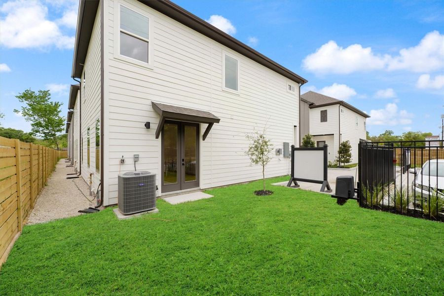 Exterior details and patio area of a home in Blalock Square, Houston (Image 1).