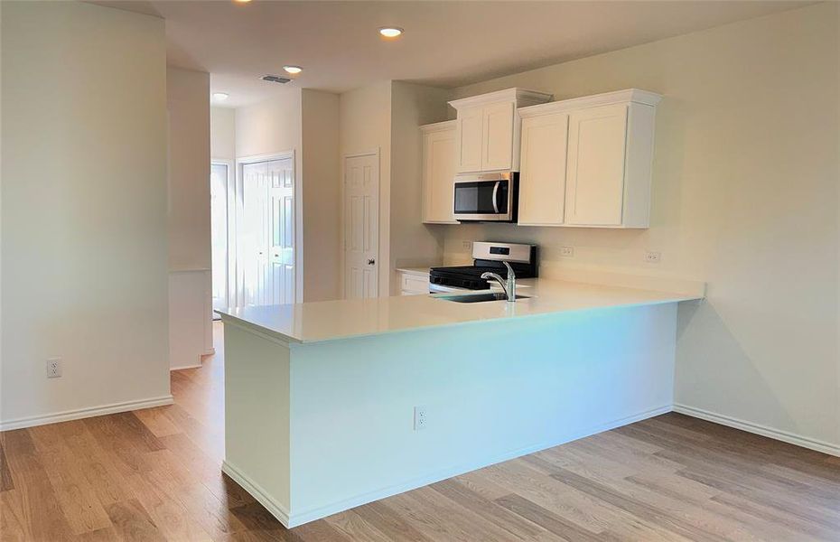 Spacious kitchen with eat-in bartop *actual home