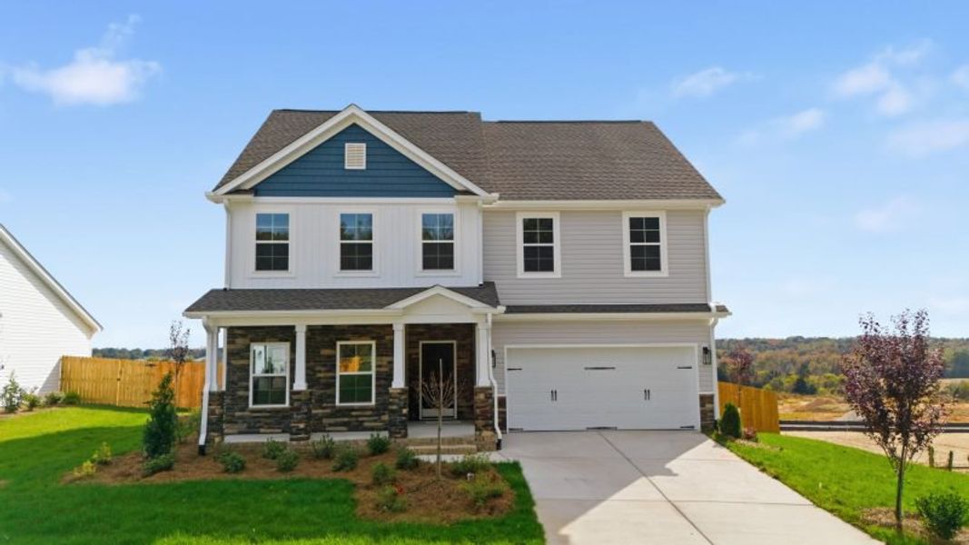 Front exterior of a new home in Miller's Reserve, Winston-Salem, NC, highlighting curb appeal (Image 27). Front exterior of a new home in Miller's Reserve, Winston-Salem, NC, highlighting curb appeal (Image 27).