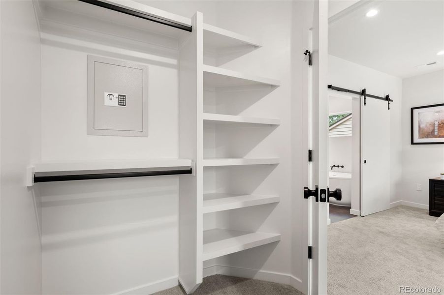 Primary closet with safe