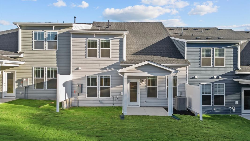 Elegant exterior with a rear covered porch perfect for relaxing or entertaining outdoors