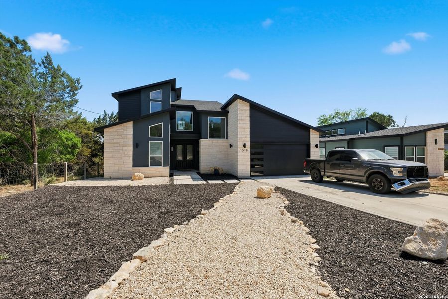Front exterior of a new home in , Canyon Lake, TX, highlighting curb appeal (Image 24).
