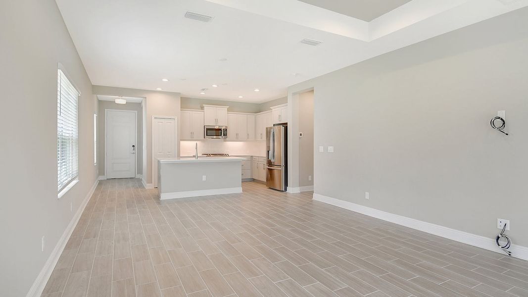 Spacious, unfurnished interior of a new home in Canoe Creek Real Estate and Homes for Sale in Parrish, FL - Neal Communities, Parrish (Image 10).