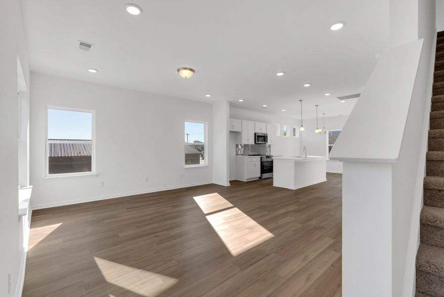 Lots of living areas with flex room on the first floor that you could use in so many different ways.  Bright rooms everywhere in this unit