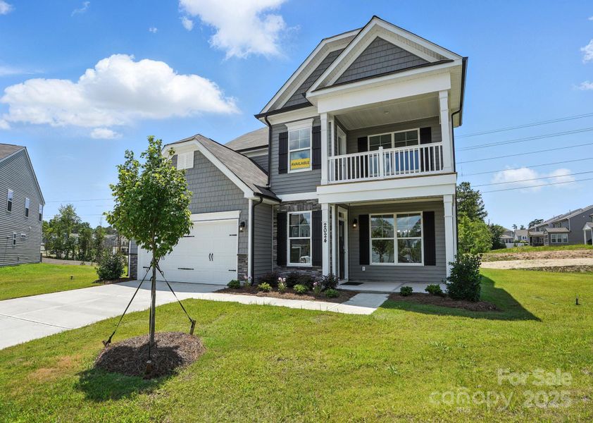 Front exterior of a new home in Hampton Woods, Charlotte, NC, highlighting curb appeal (Image 2).