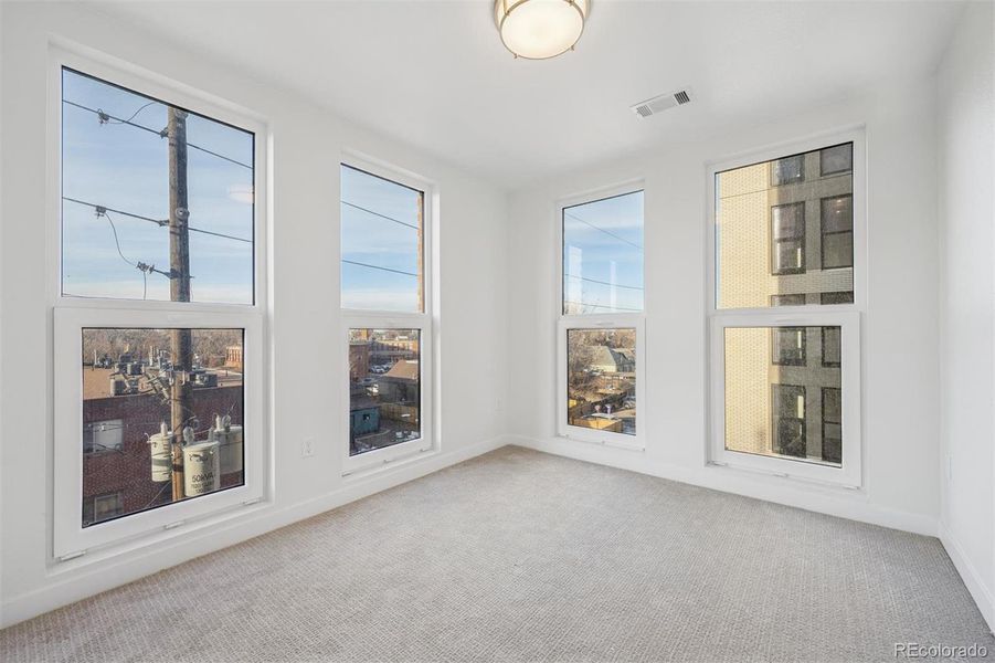 Versatile secondary bedrooms with great natural light and flexible use for guests, office, or additional living space.