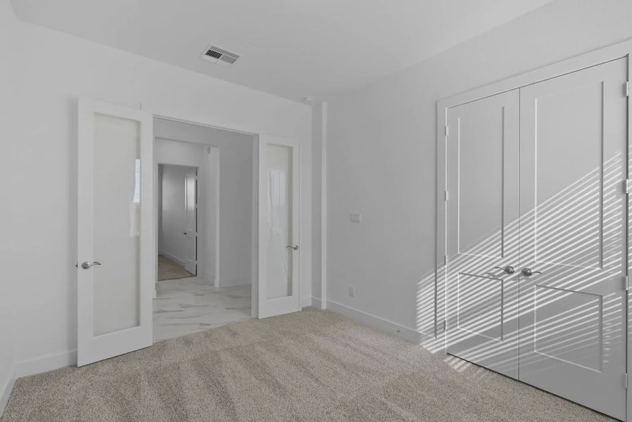 Representative unfurnished interior of a home built from the Nicklaus by Chesmar Homes in Riceland Alley Loads, Mont Belvieu (Image 74).