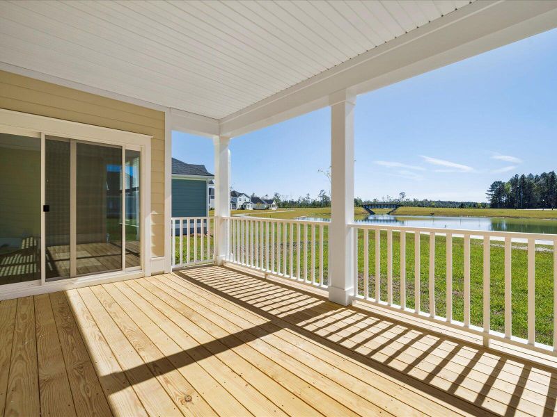 Exterior details and patio area of a home in The Coves at Lakes of Cane Bay II, Summerville (Image 26).