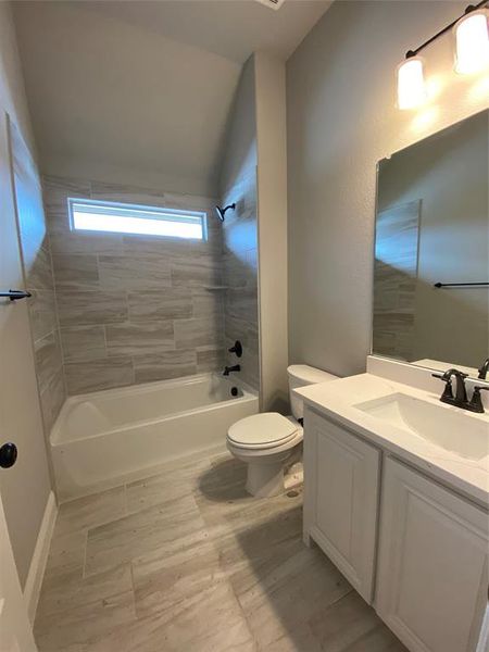 Bath 2 with window has 12x24 tile, white cabinets & Calacatta Lincoln quartz. Bath 2 with window has 12x24 tile, white cabinets & Calacatta Lincoln quartz.