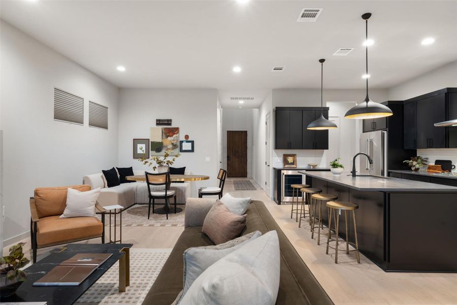 An open-concept living space integrates a well-appointed kitchen and dining area. An open-concept living space integrates a well-appointed kitchen and dining area.