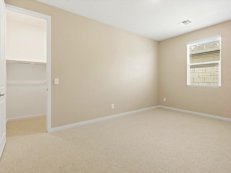 Spacious, unfurnished interior of a new home in White Tank Foothills Signature Series, Waddell (Image 17).