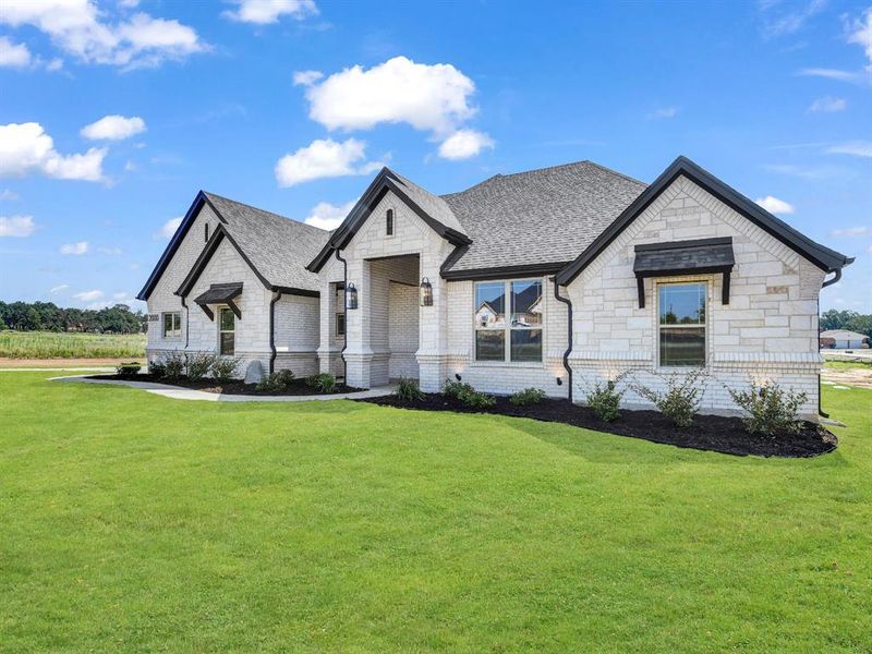 Front exterior of a new home in , Azle, TX, highlighting curb appeal (Image 27). Front exterior of a new home in , Azle, TX, highlighting curb appeal (Image 27).