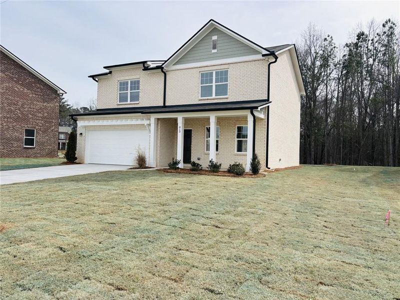 Front exterior of a new home in Kendall Grove, McDonough, GA, highlighting curb appeal (Image 7). Front exterior of a new home in Kendall Grove, McDonough, GA, highlighting curb appeal (Image 7).