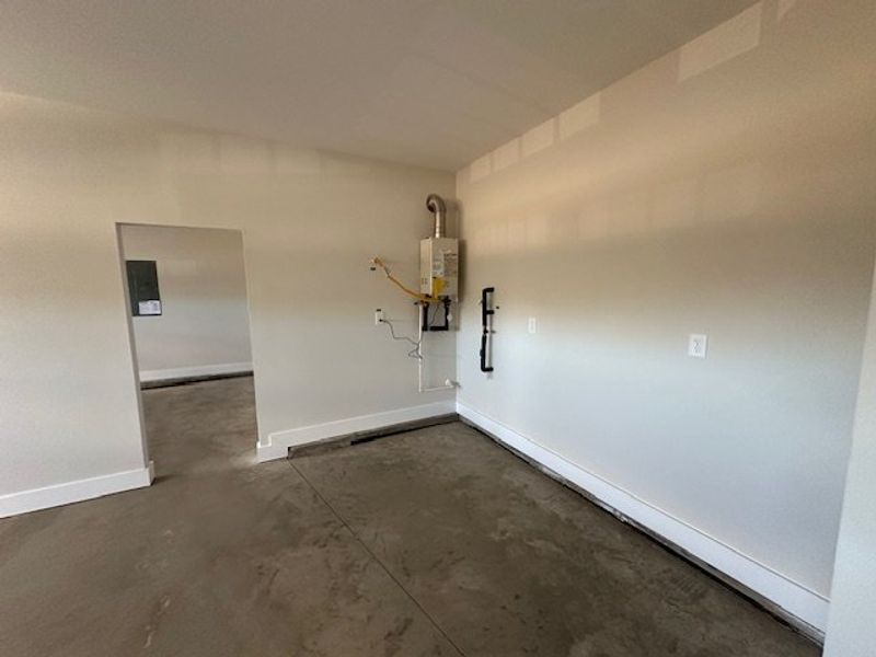 This garage offers ample space and includes a tank