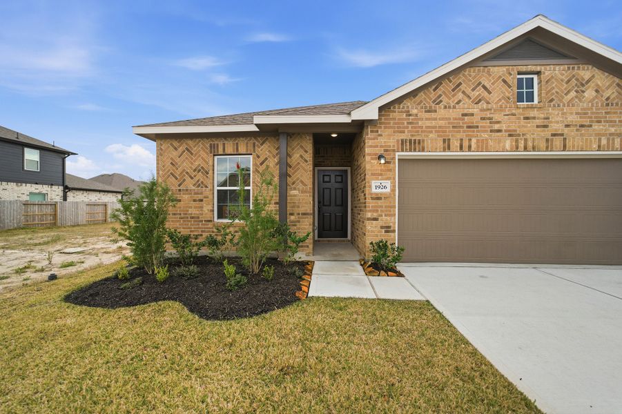 Front exterior of a new home in Windrose Green, Angleton, TX, highlighting curb appeal (Image 18). Front exterior of a new home in Windrose Green, Angleton, TX, highlighting curb appeal (Image 18).