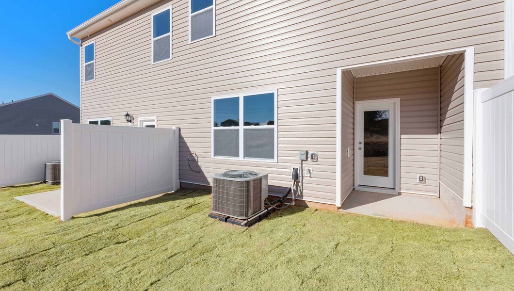 Exterior details and patio area of a home in Covington Village, Greer (Image 3).