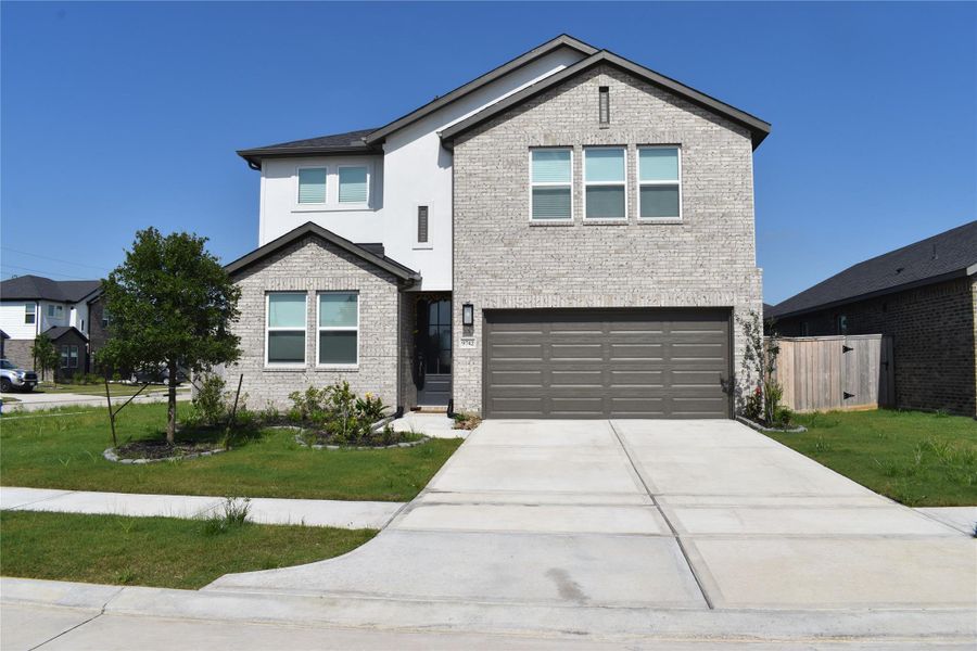 Front exterior of a new home in Bridge Creek 45s and 50s, Cypress, TX, highlighting curb appeal (Image 23). Front exterior of a new home in Bridge Creek 45s and 50s, Cypress, TX, highlighting curb appeal (Image 23).