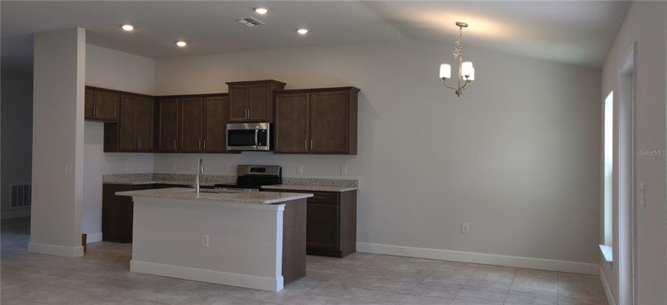 Furnished interior view inside a new home in Sunset Landing, Spring Hill (Image 4).