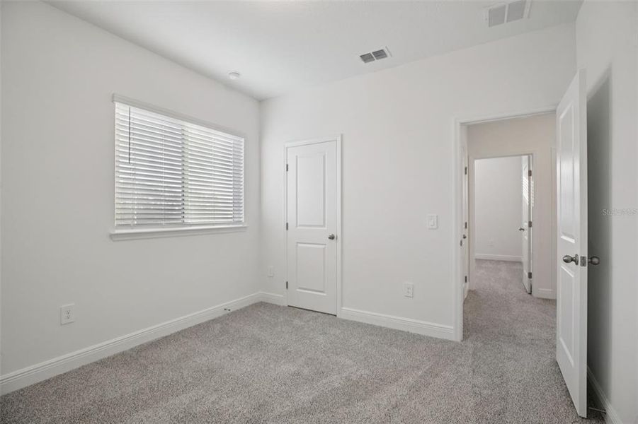 Spacious, unfurnished interior of a new home in Cyrene at Minneola - Villas, Minneola (Image 40).