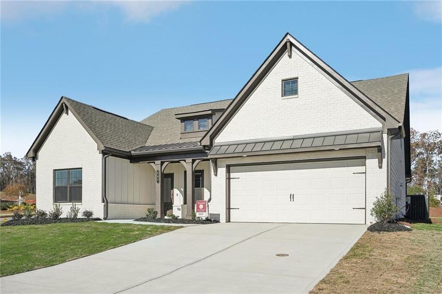 Front exterior of a new home in Pinecrest Ridge, Dacula, GA, highlighting curb appeal (Image 26). Front exterior of a new home in Pinecrest Ridge, Dacula, GA, highlighting curb appeal (Image 26).