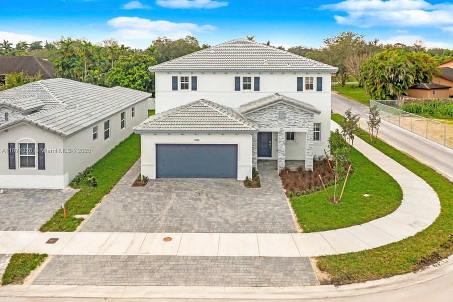 Front exterior of a new home in , Miami, FL, highlighting curb appeal (Image 2). Front exterior of a new home in , Miami, FL, highlighting curb appeal (Image 2).