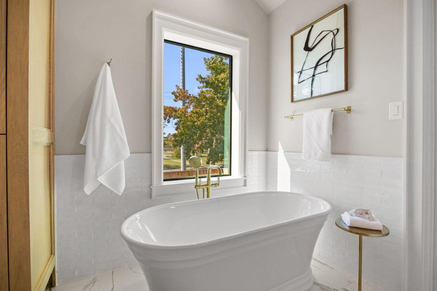 Beautiful Soak tub w/ a classic fixture & handheld sprayer.
