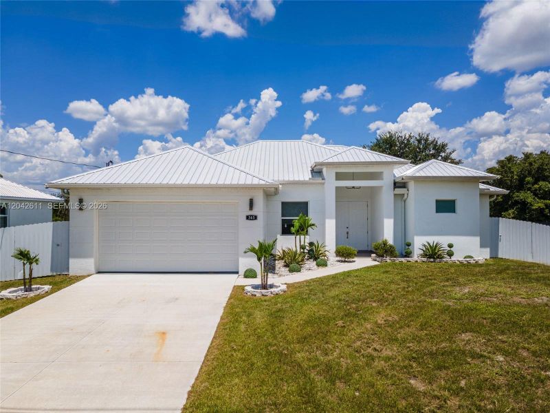 Front exterior of a new home in , Lehigh Acres, FL, highlighting curb appeal (Image 25).