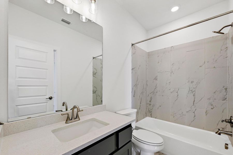 Furnished interior view inside a new home in Rough Hollow, Austin (Image 6).