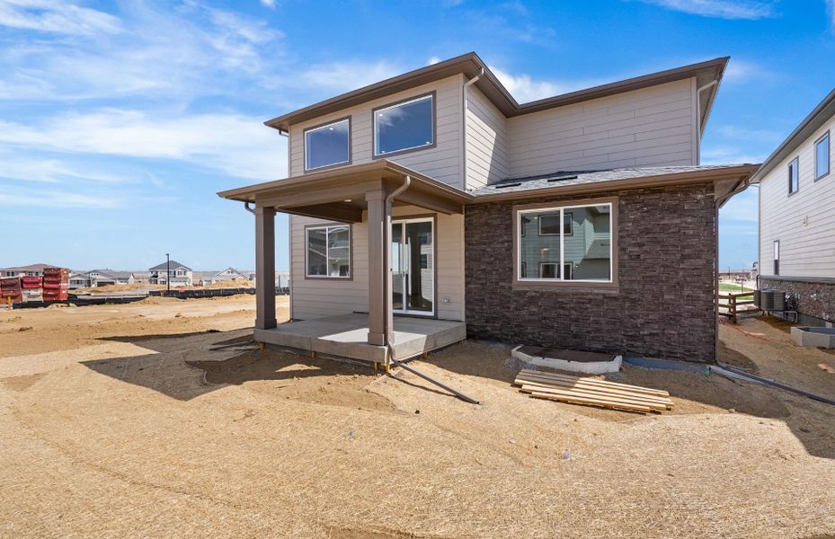 Exterior details and patio area of a home in Harvest Crossing, Aurora (Image 22).