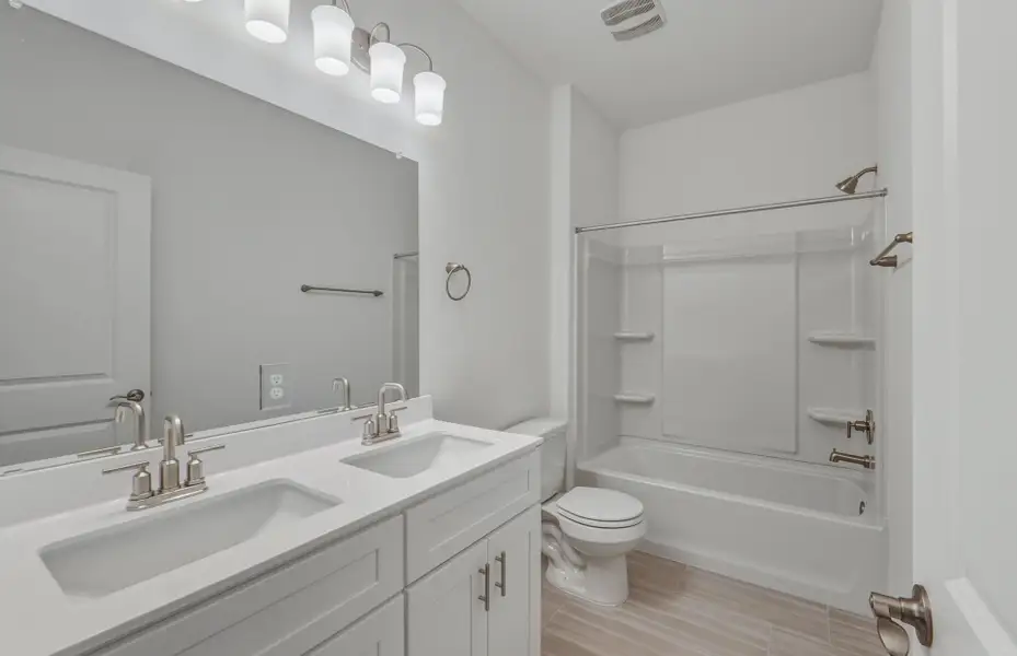 Furnished interior view inside a new home in Crosswinds, Kyle (Image 9).