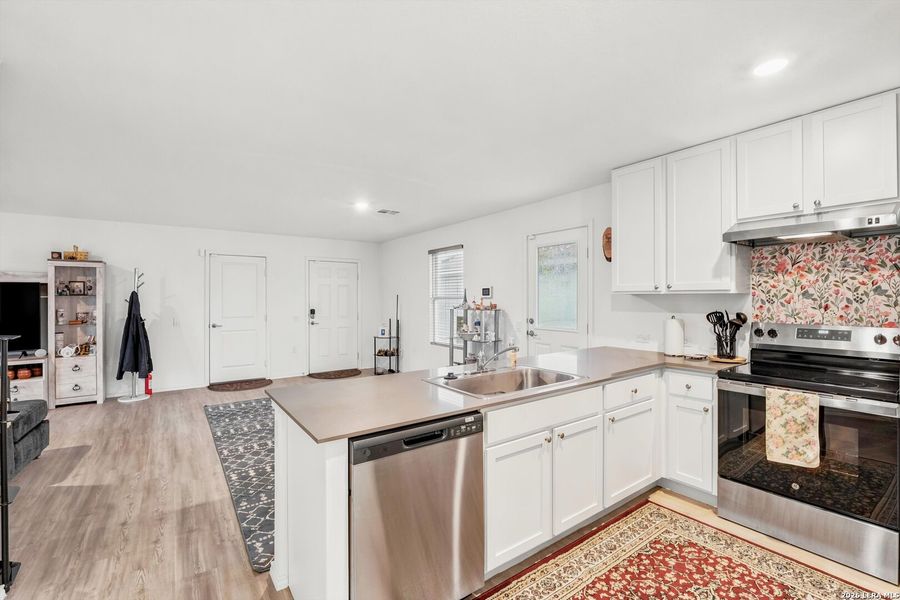 Furnished interior view inside a new home in Tarasco Gardens, San Antonio (Image 13).