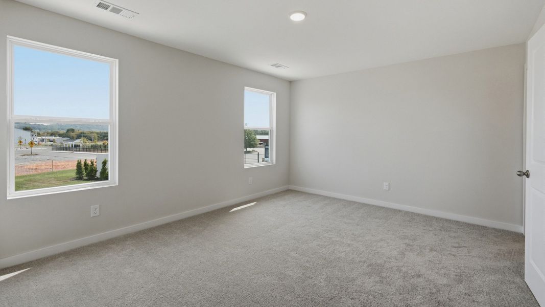 Primary room with connected bathroom and walk-in closet