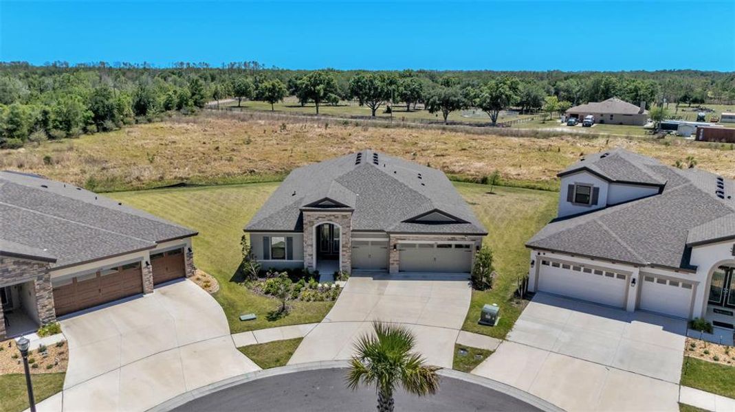 Front exterior of a new home in Hawkstone, Lithia, FL, highlighting curb appeal (Image 26).