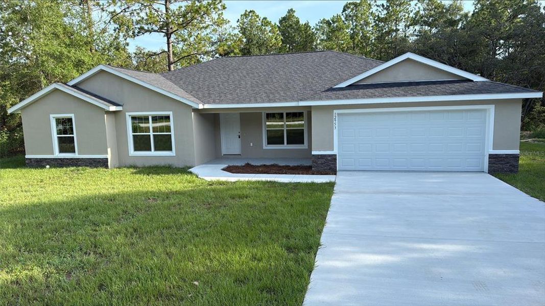 Front exterior of a new home in , Dunnellon, FL, highlighting curb appeal (Image 18).