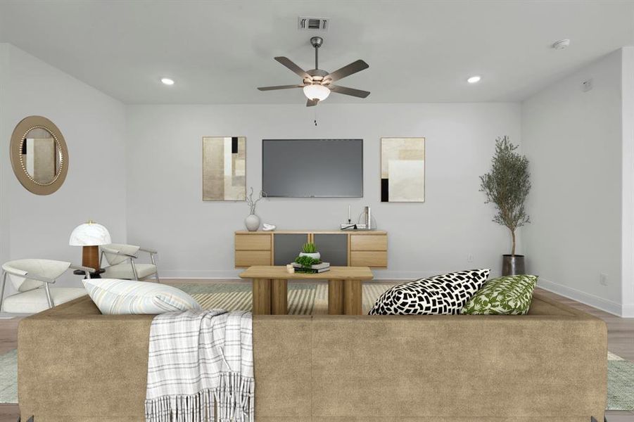 Living area featuring wood finished floors, ceiling fan, and recessed lighting Living area featuring wood finished floors, ceiling fan, and recessed lighting