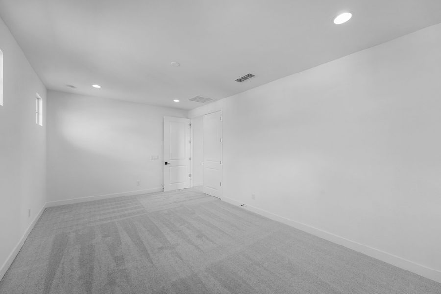 Spacious, unfurnished interior of a new home in Ellsworth Ranch Voyage Collection, Queen Creek (Image 22).