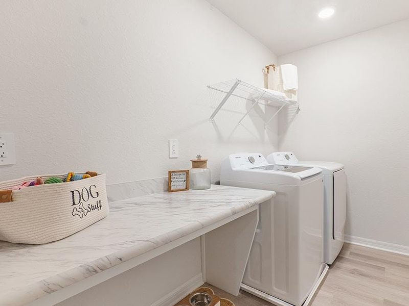Plus, you will appreciate access to the laundry room from your owner`s bath - Aspen townhome by Highland Homes Plus, you will appreciate access to the laundry room from your owner`s bath - Aspen townhome by Highland Homes