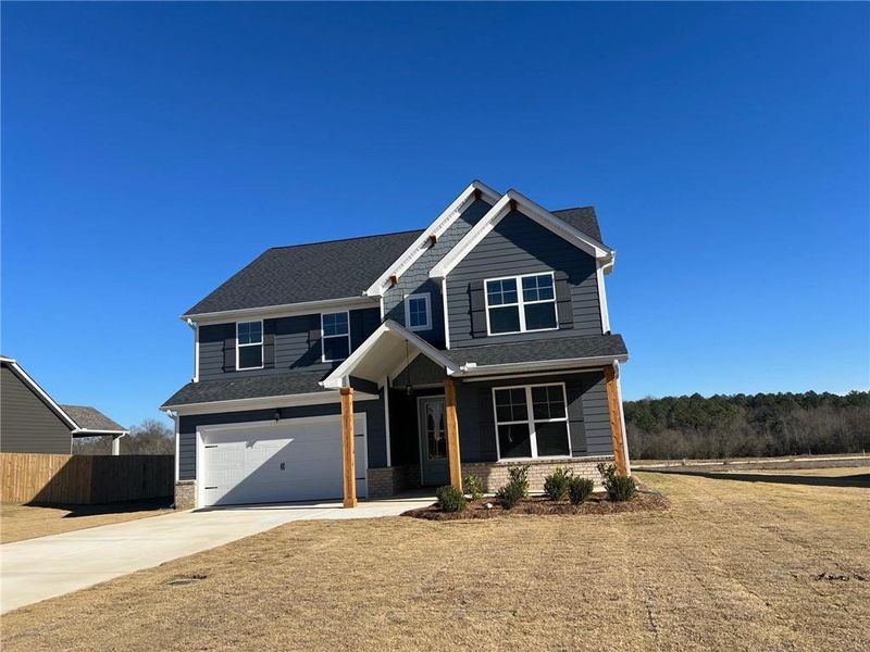 Front exterior of a new home in , Bonaire, GA, highlighting curb appeal (Image 2). Front exterior of a new home in , Bonaire, GA, highlighting curb appeal (Image 2).