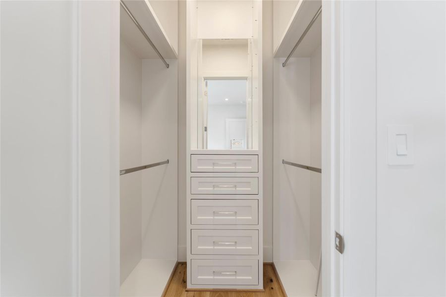 All of the secondary bedroom’s closets feature built-ins perfect for shoes and accessories. Plentiful hanging rods and drawers will house runway looks effortlessly.