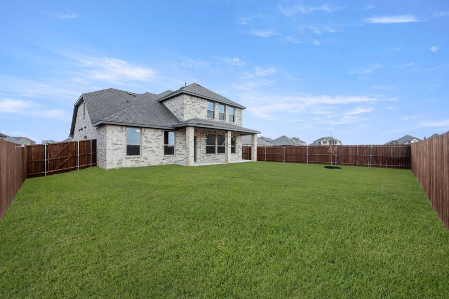 Front exterior of a new home in Timberbrook, Justin, TX, highlighting curb appeal (Image 27). Front exterior of a new home in Timberbrook, Justin, TX, highlighting curb appeal (Image 27).